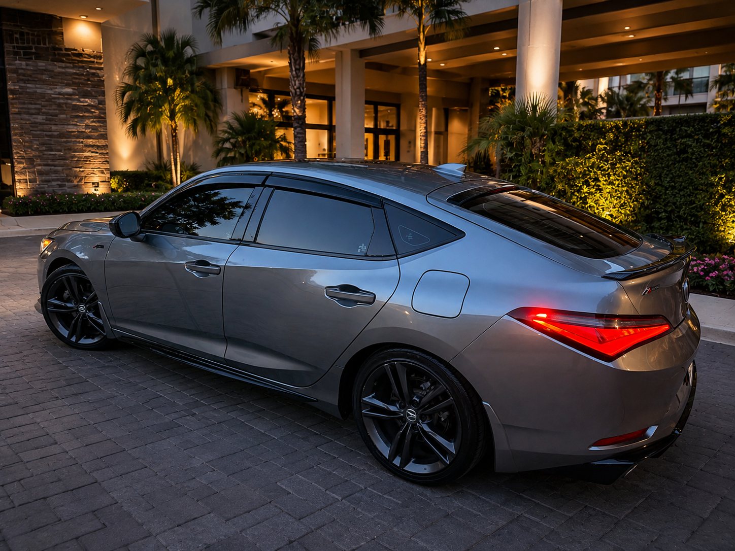 Rear three-quarter view of the gray Acura Integra A-Spec used by Northshore Elite Services