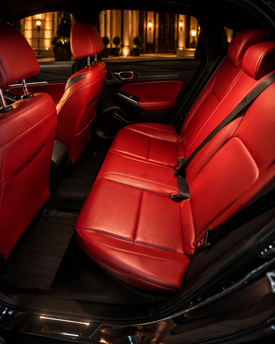 Red leather rear passenger seating inside the Northshore Elite Services vehicle